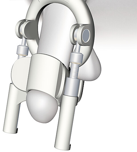 Иллюстрация аппарата PeniMaster, надетого на половой член в варианте ношения вниз.