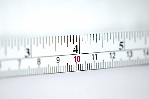 Folding metre stick with units centimetres and inches